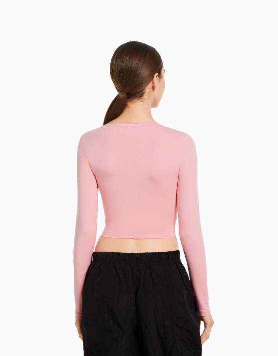 Rosa Bershka unisex Langarm-T-Shirt mit gekreuzten Ärmeln H00J3753